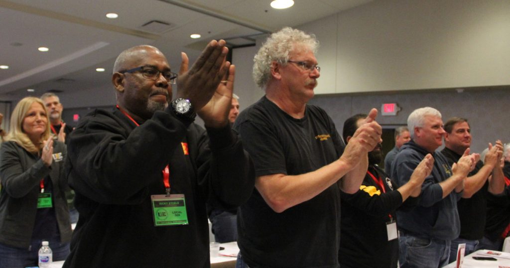 UE convention delegates giving a standing ovation